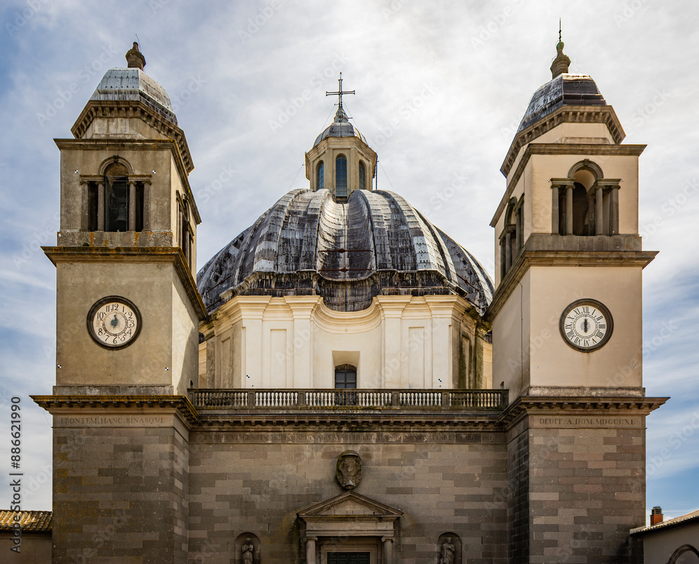 A glimpse of the ancient medieval village of Montefiascone, Viterbo, Italy. The Cathedral of Santa Margherita, with its large dome and the two bell towers, with clocks, on the sides.