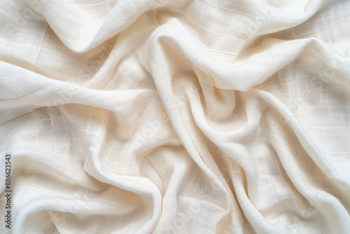 Close-up of soft, white, crumpled fabric with a delicate pattern, showcasing texture and elegance perfect for fashion, design, or background use.