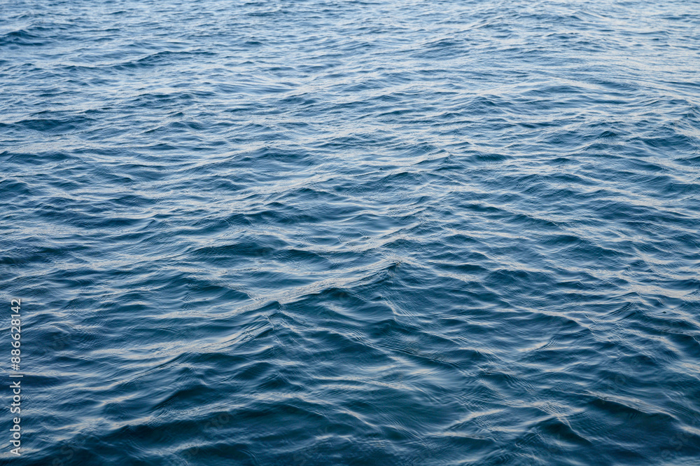 Rippled gleaming aquamarine sea water surface with shiny sparkles Rippled gleaming aquamarine sea water surface with shiny sparkles