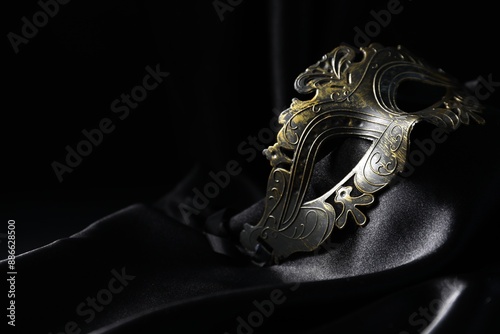 Obraz na płótnie Beautiful golden carnival mask on black background, closeup