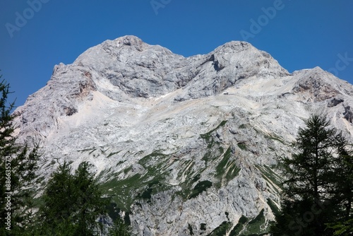 Triglav peak in Julian Alps, Slovenia with small Dom Planika pod Triglavom house photo