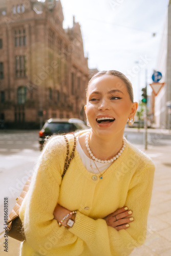 Obraz na płótnie Portrait of young attractive woman fashion model posing outdoor at city street . w salonie