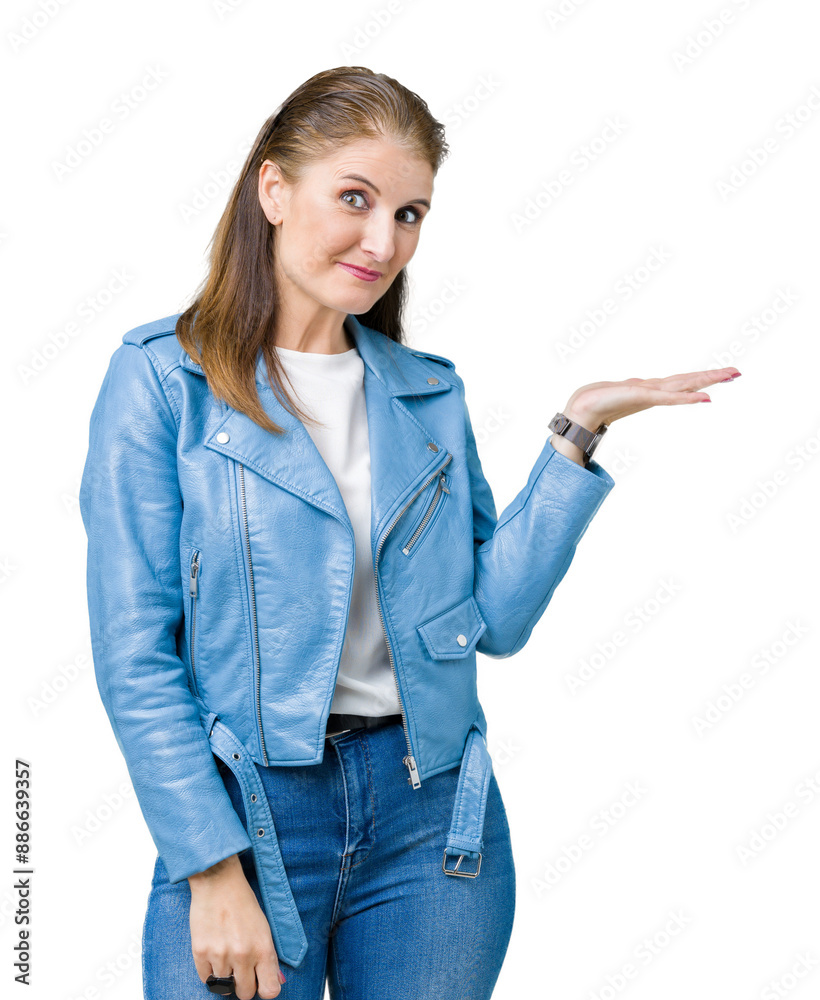 Beautiful middle age mature woman wearing fashion leather jacket over isolated background smiling cheerful presenting and pointing with palm of hand looking at the camera. Beautiful middle age mature woman wearing fashion leather jacket over isolated background smiling cheerful presenting and pointing with palm of hand looking at the camera.