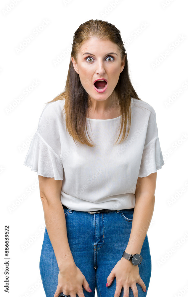 Middle age mature beautiful woman over isolated background afraid and shocked with surprise expression, fear and excited face. Middle age mature beautiful woman over isolated background afraid and shocked with surprise expression, fear and excited face.
