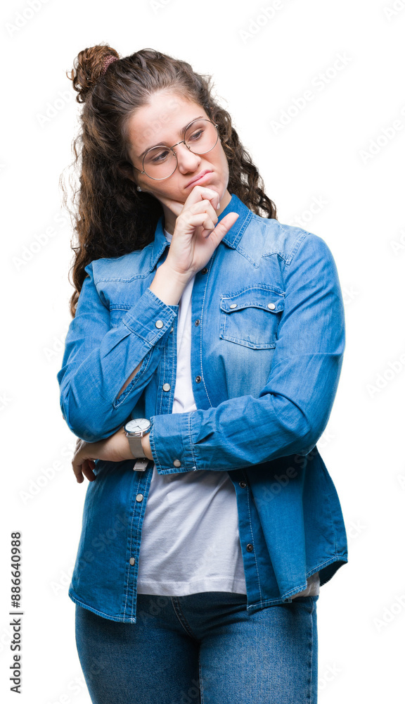 Beautiful young brunette curly hair girl wearing glasses over isolated background thinking looking tired and bored with depression problems with crossed arms. Beautiful young brunette curly hair girl wearing glasses over isolated background thinking looking tired and bored with depression problems with crossed arms.