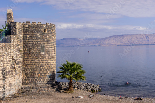 The old city of Tiberias, the wall and tower, on the coast of Sea of Galilee, with the confl

