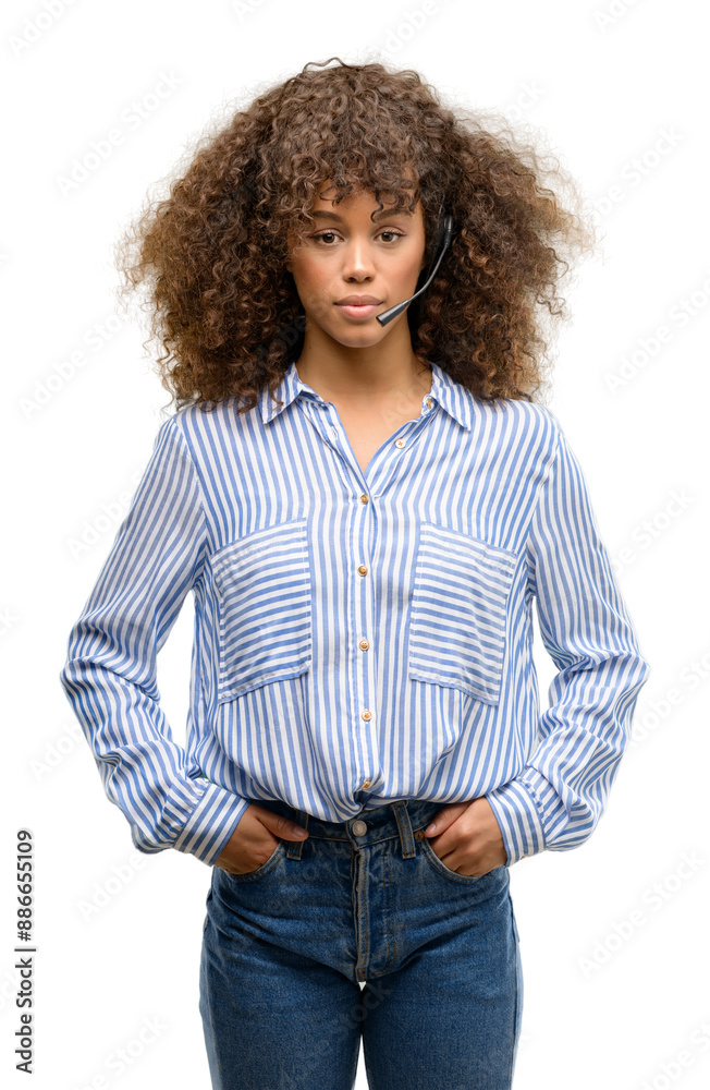 African american call center operator woman with a confident expression on smart face thinking serious African american call center operator woman with a confident expression on smart face thinking serious