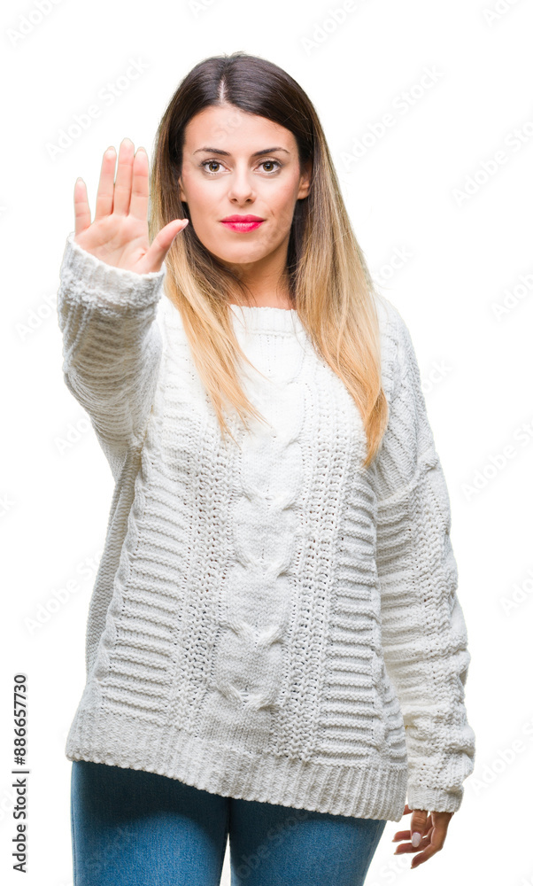 Young beautiful woman casual white sweater over isolated background doing stop sing with palm of the hand. Warning expression with negative and serious gesture on the face. Young beautiful woman casual white sweater over isolated background doing stop sing with palm of the hand. Warning expression with negative and serious gesture on the face.