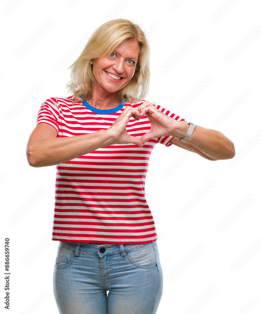 Middle age blonde woman over isolated background smiling in love showing heart symbol and shape with hands. Romantic concept. Middle age blonde woman over isolated background smiling in love showing heart symbol and shape with hands. Romantic concept.