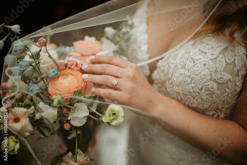 Bride hand on flowers