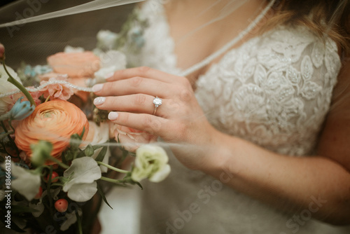Bride hand on flowers