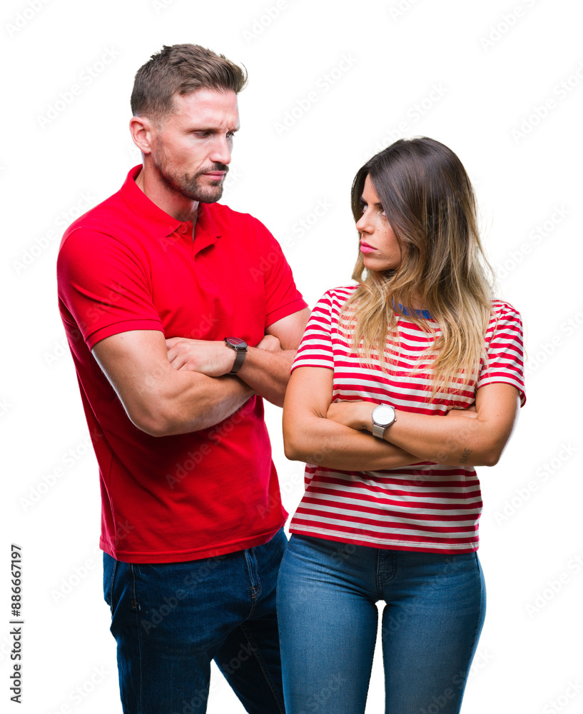 Young couple in love over isolated background skeptic and nervous, disapproving expression on face with crossed arms. Negative person. Young couple in love over isolated background skeptic and nervous, disapproving expression on face with crossed arms. Negative person.