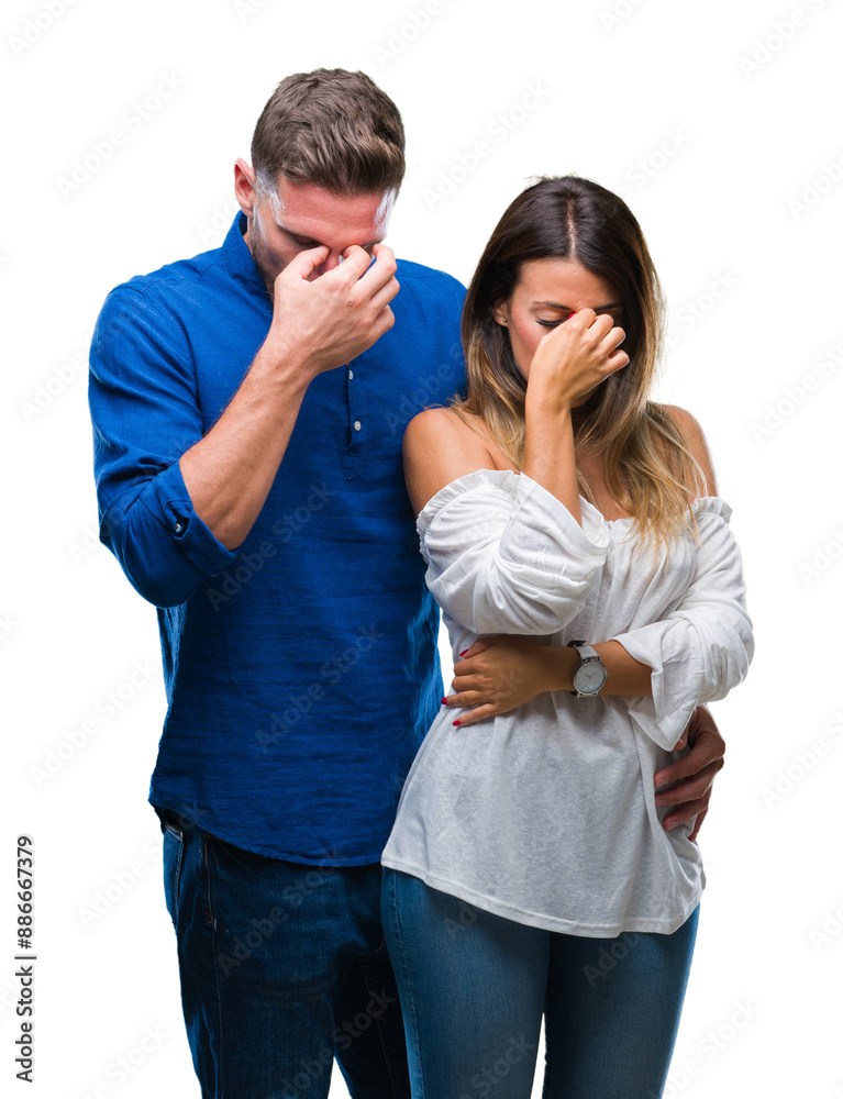 Young couple in love over isolated background tired rubbing nose and eyes feeling fatigue and headache. Stress and frustration concept. Young couple in love over isolated background tired rubbing nose and eyes feeling fatigue and headache. Stress and frustration concept.