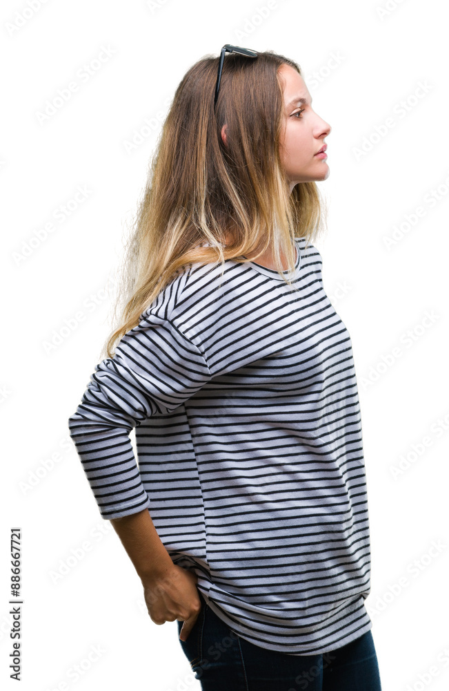 Young beautiful blonde woman wearing sunglasses over isolated background looking to side, relax profile pose with natural face with confident smile. Young beautiful blonde woman wearing sunglasses over isolated background looking to side, relax profile pose with natural face with confident smile.
