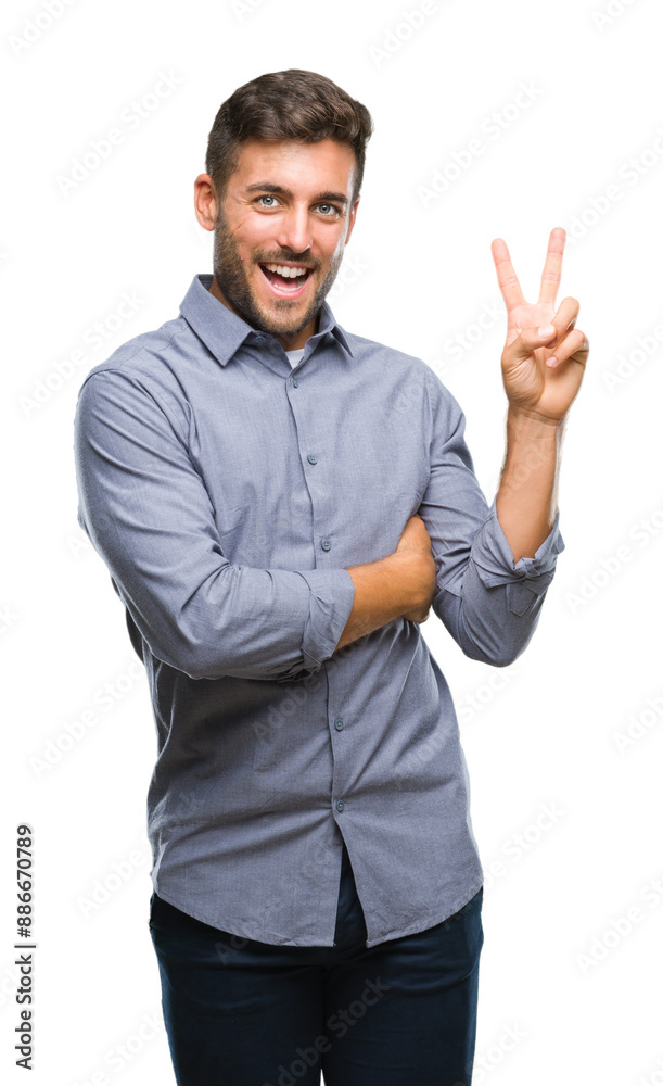 Young handsome man over isolated background smiling with happy face winking at the camera doing victory sign. Number two. Young handsome man over isolated background smiling with happy face winking at the camera doing victory sign. Number two.