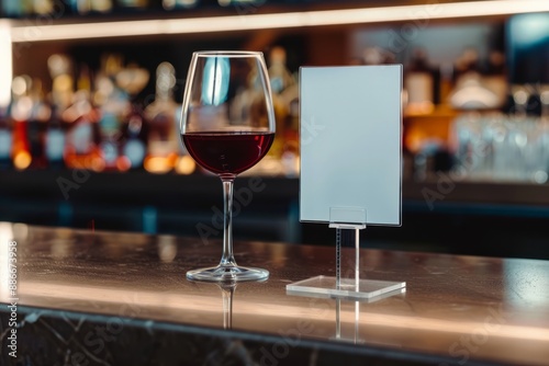  Wine menu mockup next to glass of red wine on bar counter