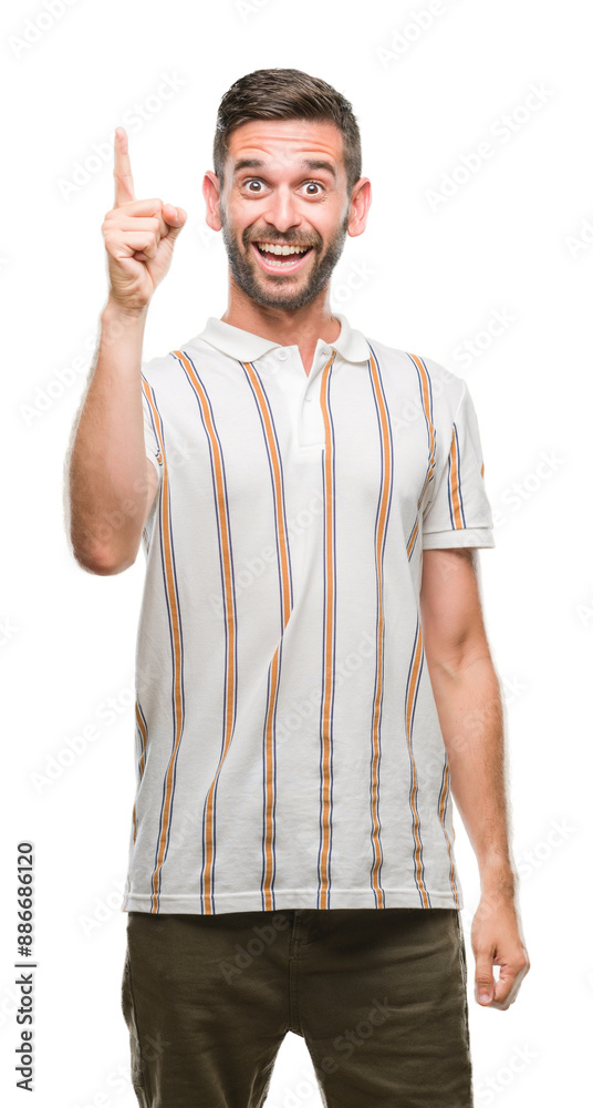Young handsome man over isolated background pointing finger up with successful idea. Exited and happy. Number one. Young handsome man over isolated background pointing finger up with successful idea. Exited and happy. Number one.