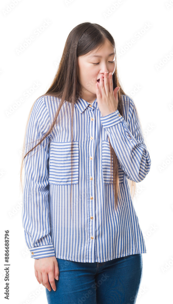 Young Chinese woman over isolated background bored yawning tired covering mouth with hand. Restless and sleepiness. Young Chinese woman over isolated background bored yawning tired covering mouth with hand. Restless and sleepiness.