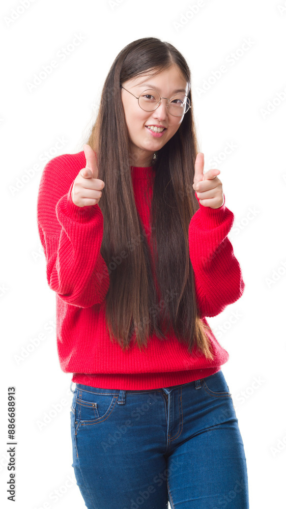 Young Chinese woman over isolated background wearing glasses pointing fingers to camera with happy and funny face. Good energy and vibes. Young Chinese woman over isolated background wearing glasses pointing fingers to camera with happy and funny face. Good energy and vibes.