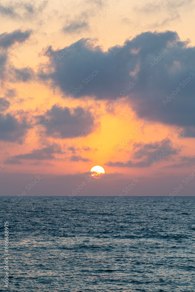 Fototapeta premium Sunset over the Mediterranean Sea at Caesarea National Park in Israel. 