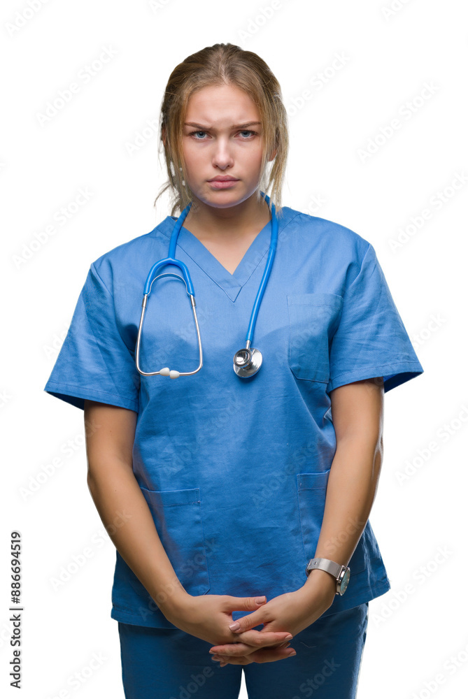 Young caucasian doctor woman wearing surgeon uniform over isolated background skeptic and nervous, frowning upset because of problem. Negative person. Young caucasian doctor woman wearing surgeon uniform over isolated background skeptic and nervous, frowning upset because of problem. Negative person.