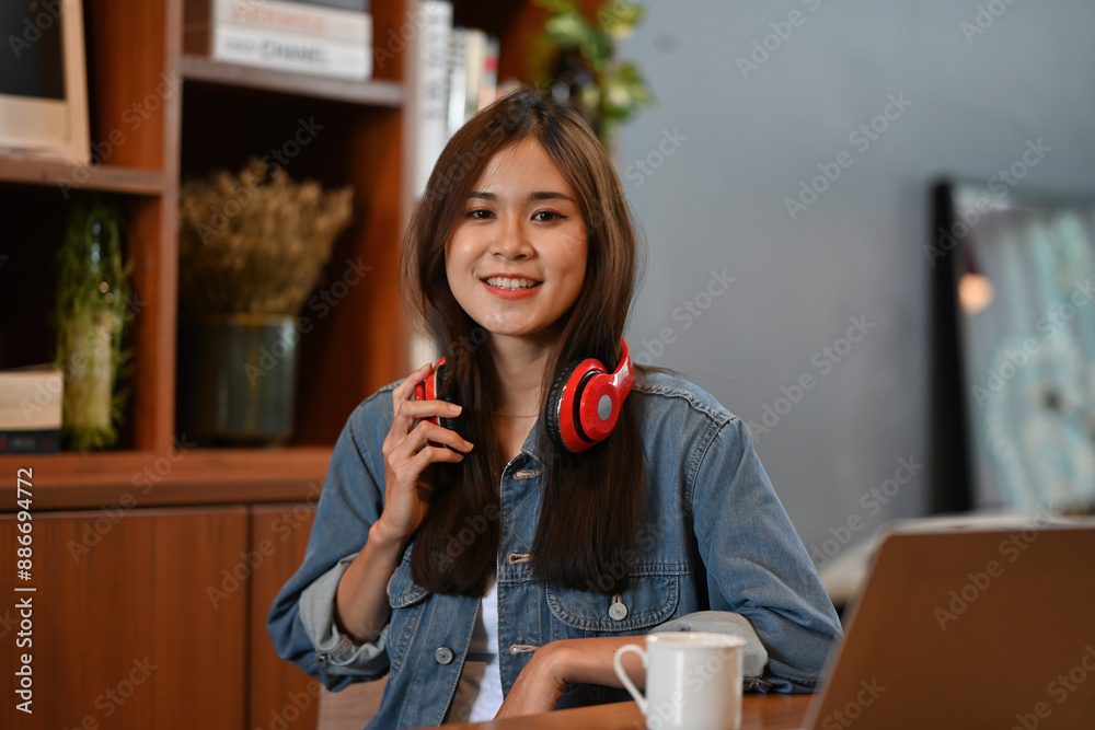 Host prepares for a podcast episode, ready to share insights and stories, set in a cozy studio with books and a laptop Host prepares for a podcast episode, ready to share insights and stories, set in a cozy studio with books and a laptop