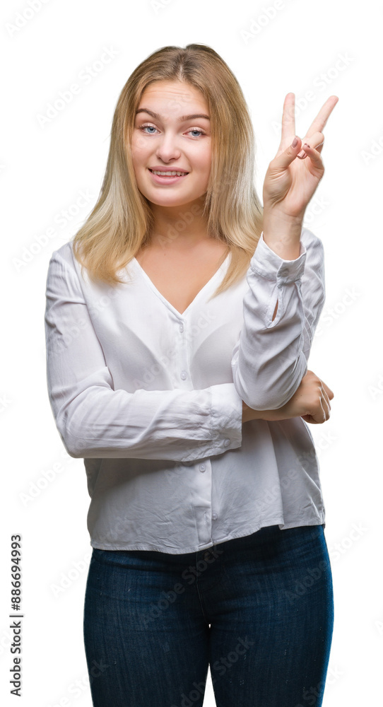 Young caucasian woman over isolated background smiling with happy face winking at the camera doing victory sign. Number two. Young caucasian woman over isolated background smiling with happy face winking at the camera doing victory sign. Number two.