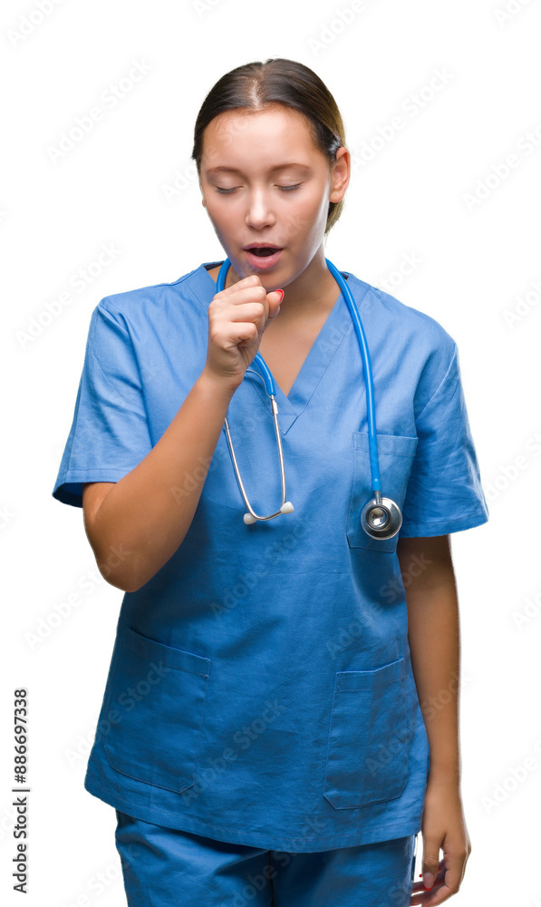 Young caucasian doctor woman wearing medical uniform over isolated background feeling unwell and coughing as symptom for cold or bronchitis. Healthcare concept. Young caucasian doctor woman wearing medical uniform over isolated background feeling unwell and coughing as symptom for cold or bronchitis. Healthcare concept.