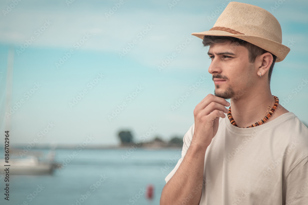 Fototapeta premium thoughtful young man looking at the sea