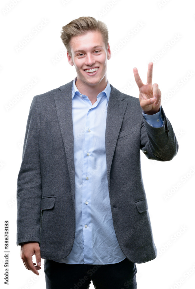 Young handsome blond business man showing and pointing up with fingers number two while smiling confident and happy. Young handsome blond business man showing and pointing up with fingers number two while smiling confident and happy.
