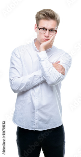 Young handsome blond man thinking looking tired and bored with depression problems with crossed arms.