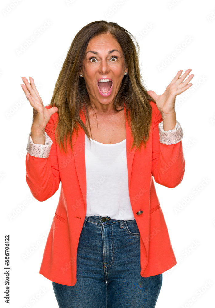 Beautiful middle age business adult woman over isolated background celebrating crazy and amazed for success with arms raised and open eyes screaming excited. Winner concept Beautiful middle age business adult woman over isolated background celebrating crazy and amazed for success with arms raised and open eyes screaming excited. Winner concept