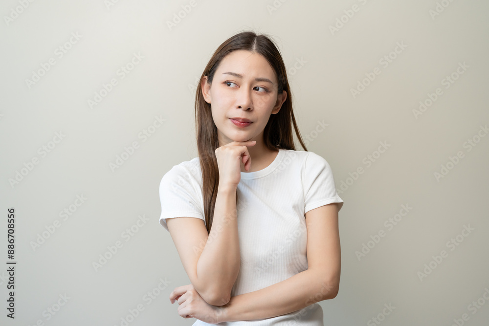 asian woman in color casual dress thinking and imagination isolated on pink background