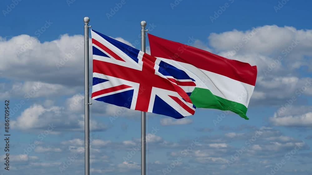 Hungary and United Kingdom flags flying together, video concept of the relationship, two country relations concept Hungary and United Kingdom flags flying together, video concept of the relationship, two country relations concept