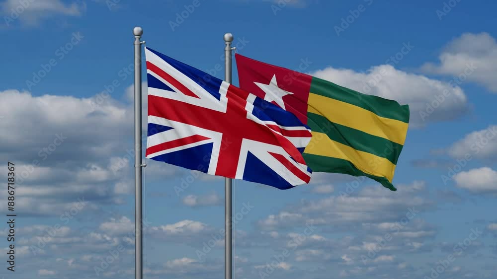 Togo, Togolese Republic and United Kingdom flags flying together, video concept of the relationship, two country cooperation concept Togo, Togolese Republic and United Kingdom flags flying together, video concept of the relationship, two country cooperation concept