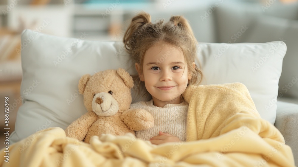 A child sad expression resting in bed with a fever and sick. A child sad expression resting in bed with a fever and sick.
