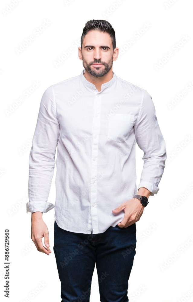Young business man over isolated background Relaxed with serious expression on face. Simple and natural looking at the camera. Young business man over isolated background Relaxed with serious expression on face. Simple and natural looking at the camera.