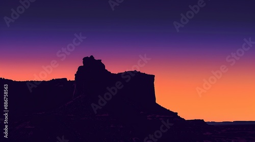 Church Rock at twilight, silhouetted against a gradient sky transitioning from orange to deep purple.