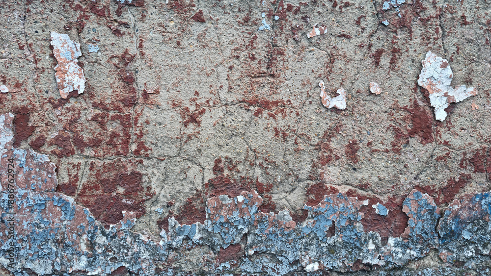 Texture of old rustic wall covered with gray and blue stucco. Multilayers of old paint on the wall. Textured background. Selective focus Texture of old rustic wall covered with gray and blue stucco. Multilayers of old paint on the wall. Textured background. Selective focus
