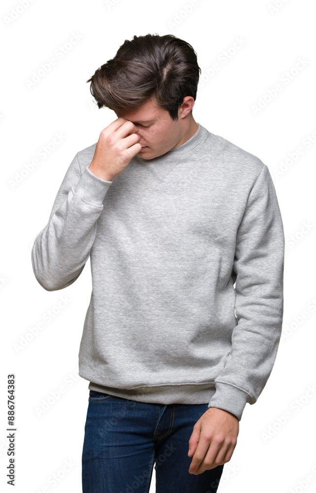 Young handsome sporty man wearing sweatshirt over isolated background tired rubbing nose and eyes feeling fatigue and headache. Stress and frustration concept. Young handsome sporty man wearing sweatshirt over isolated background tired rubbing nose and eyes feeling fatigue and headache. Stress and frustration concept.