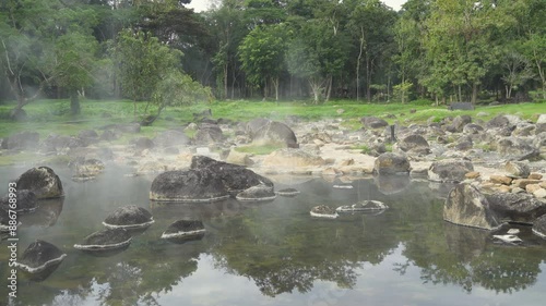 Natural hot spring mineral water with steam in Chae Son National Park in the morning, Lampang, Thailand.