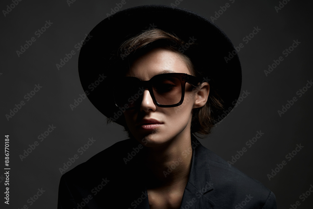 Beautiful young woman in sunglasses and Hat. Lady Beautiful young woman in sunglasses and Hat. Lady