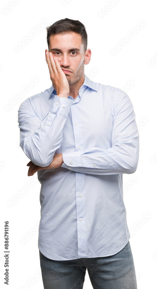 Handsome young businessman thinking looking tired and bored with depression problems with crossed arms. Handsome young businessman thinking looking tired and bored with depression problems with crossed arms.