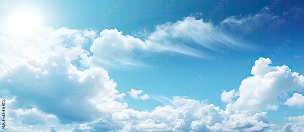 Sunny weather with bright blue sky and fluffy white clouds, ideal as a nature-themed background. The serene image portrays a heavenly landscape with ample space for text or design elements. Sunny weather with bright blue sky and fluffy white clouds, ideal as a nature-themed background. The serene image portrays a heavenly landscape with ample space for text or design elements.