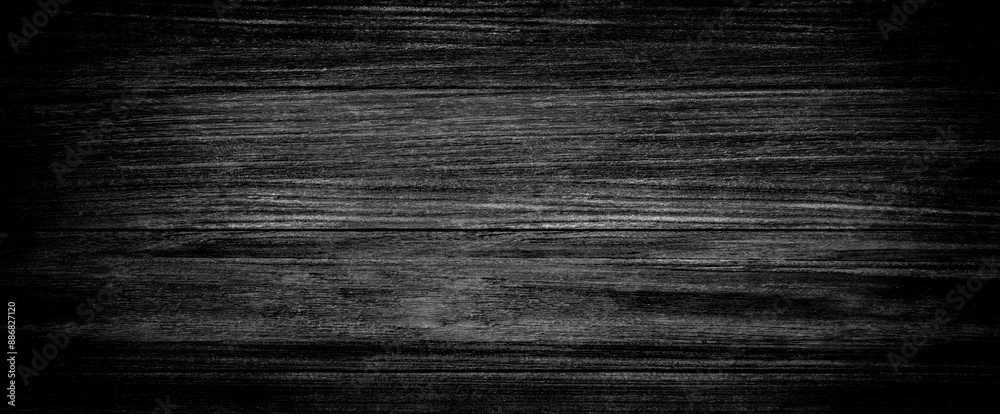 Naklejka premium Dark black wooden background or texture