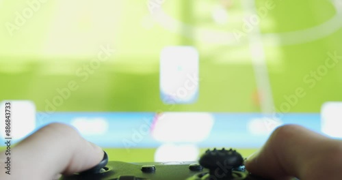 User Playing EA Sport FC 24 Fifa Football Game on Xbox One Wireless Gamepad Controller - Close-Up