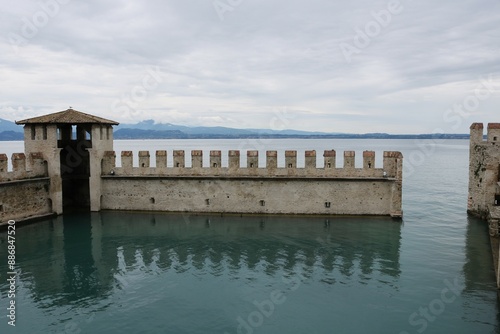 Garda lake  is the largest lake in Italy. It is a popular holiday location in northern Italy, between Brescia and Milan to the west, and Verona and Venice to the east. photo