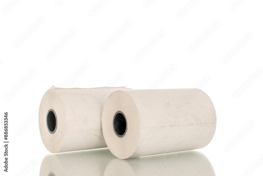Fototapeta premium Two rolls of paper cash register tape, close-up isolated on white.