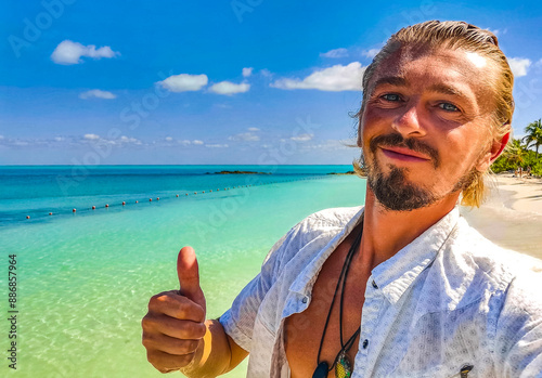 Handsome male tourist tropical natural beach panorama Contoy island Mexico. photo