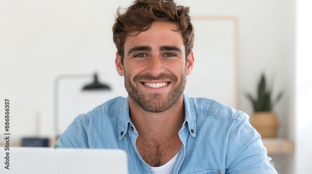 A man with a beard and a green shirt is smiling A man with a beard and a green shirt is smiling